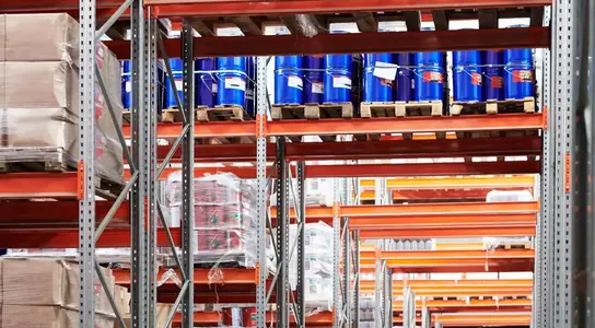 Organised pallet racking aisles of stored stock