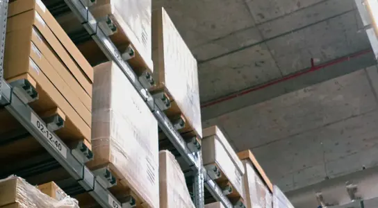 Labelled cartons stacked on racking for a wholesale order