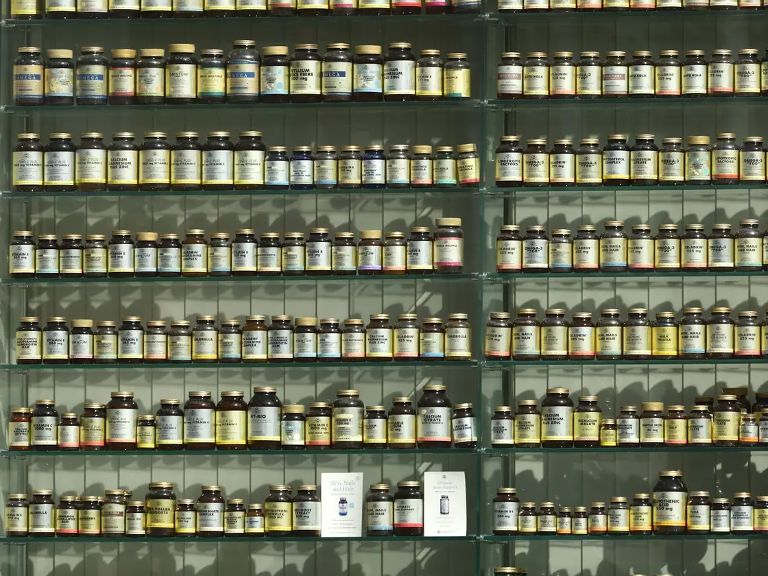 Supplement jars lined up in rows on shelving